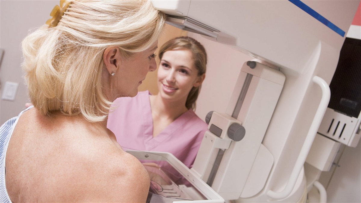 A nurse administers a mammogram for a patient.