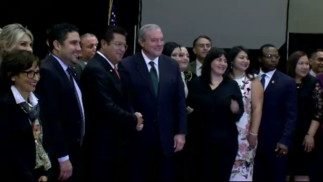 The mayors of El Paso and Juarez shake hands at a past sister-cities gathering.