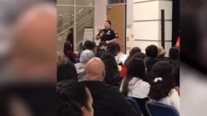 Image from video shows Border Patrol agent in a school on a search.