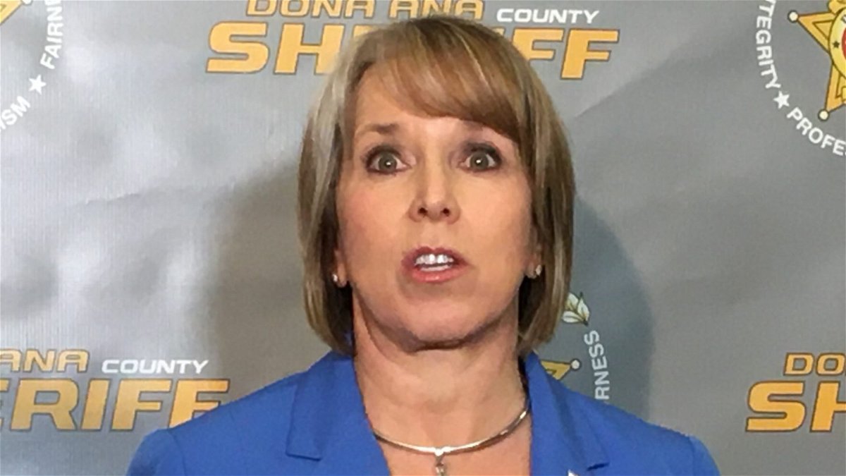 New Mexico Gov. Michelle Lujan Grisham speaks to reporters at the Dona An County Sheriff's Office.