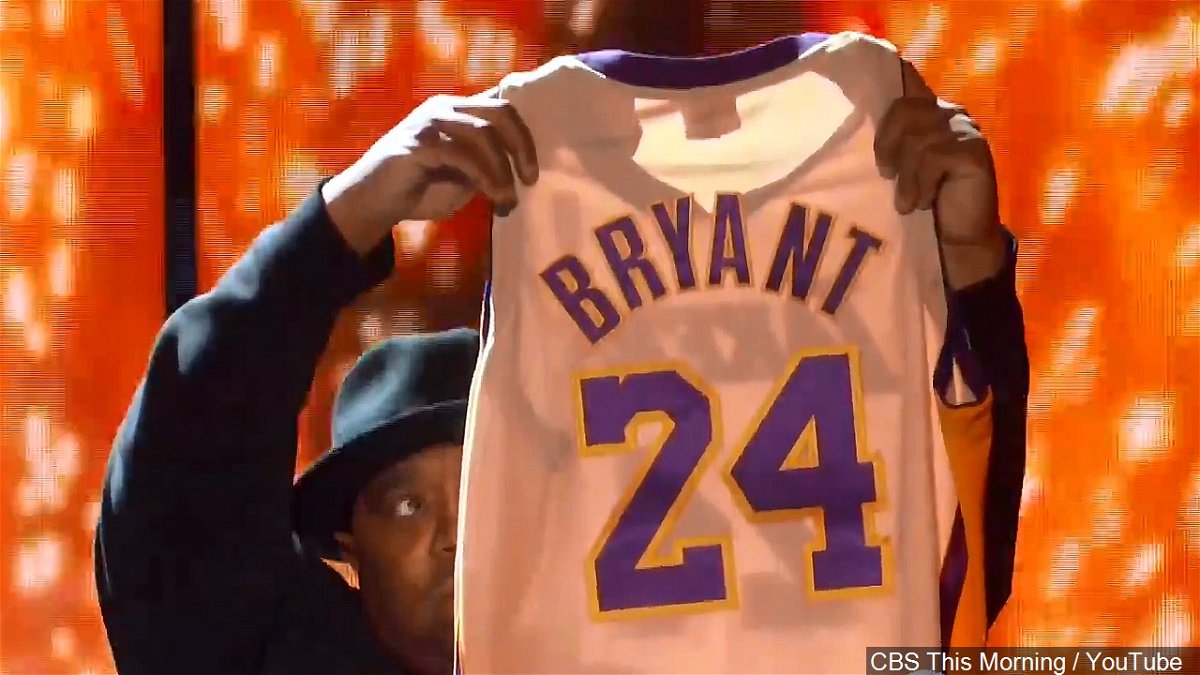 A Kobe Bryant Lakers jersey is held up at the Staples Center in L.A.