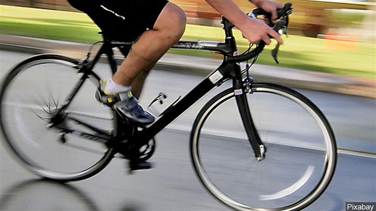 A man pedals a bicycle in this file photo.