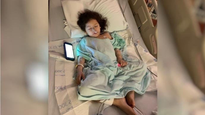 A 3-year-old Midland girl is seen in her hospital bed after reportedly being shot by police.