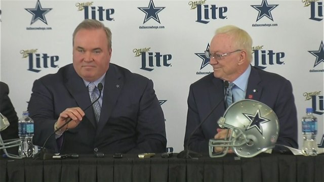 Mike McCarthy sits alongside Dallas Cowboys owner Jerry Jones as he's introduced as the team's new coach.