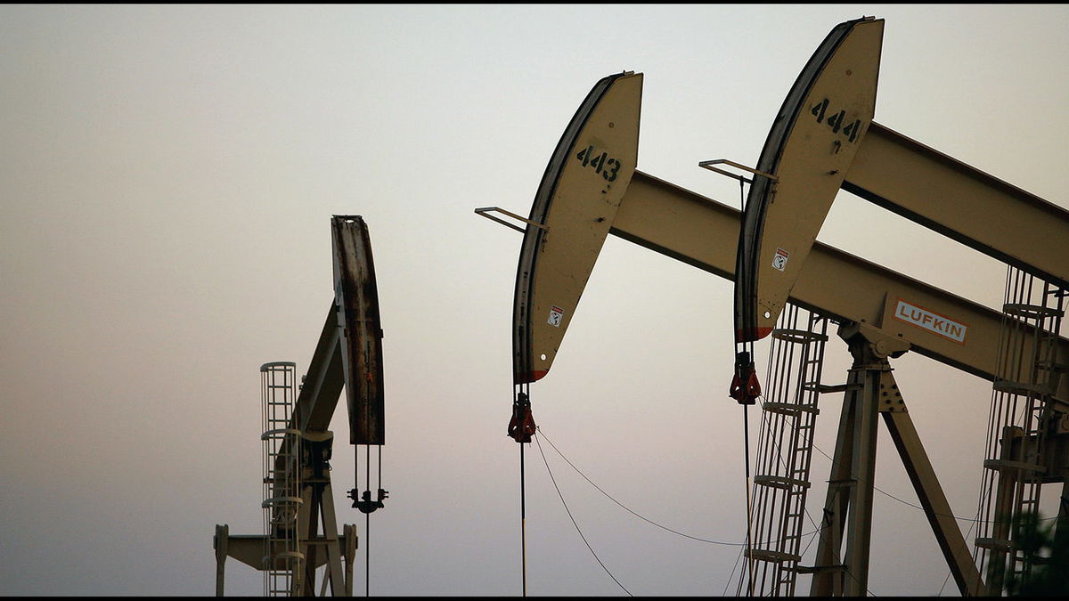 Oil wells and pumps are seen in this file photo.