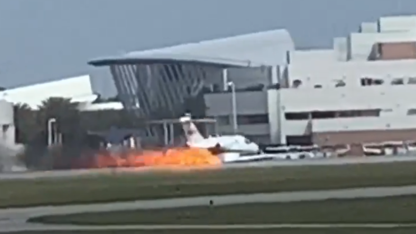 A small plane skids on the runway at Daytona airport.