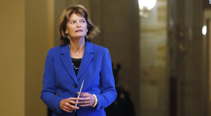 Sen. Lisa Murkowski, R-Alaska, returns to the Senate chamber after a meeting in the Majority Leaders office during a break in the impeachment trial of President Donald Trump at the U.S. Capitol Friday Jan 31, 2020, in Washington. (AP Photo/Steve Helber)