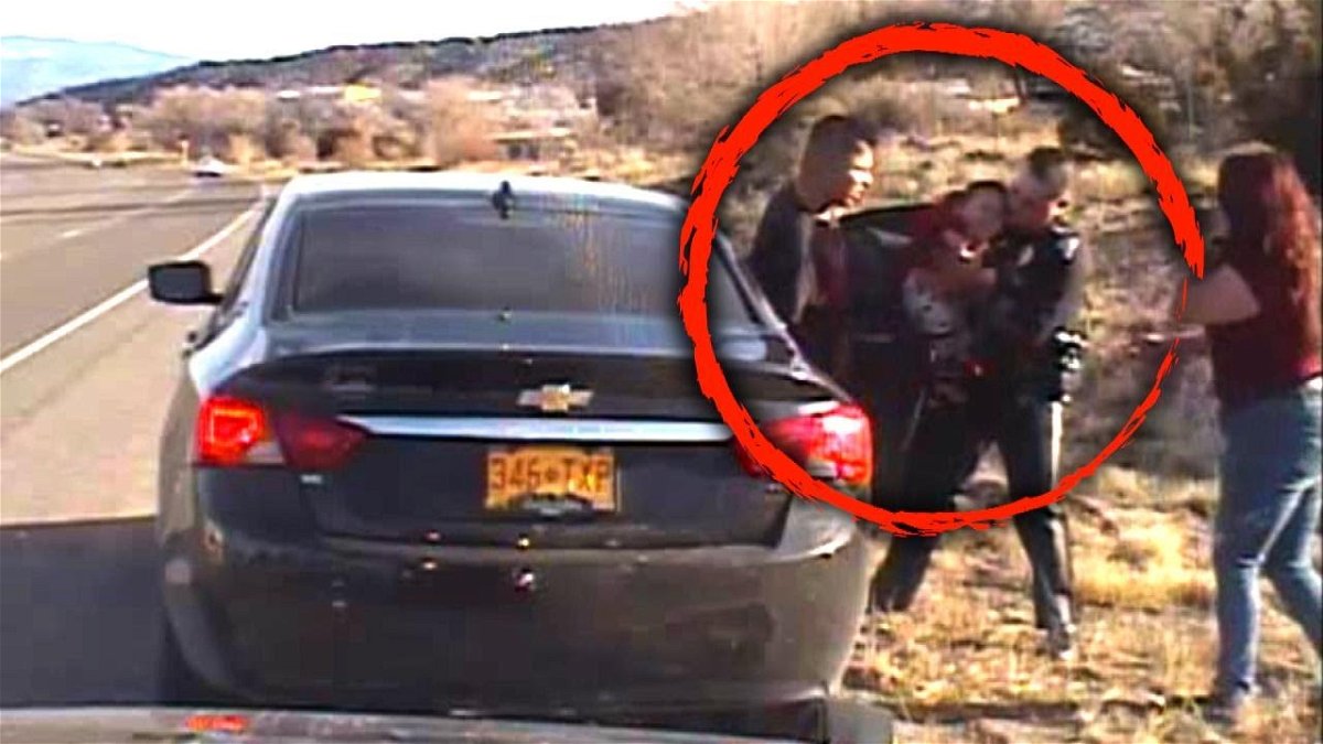 A state police officer is seen in this image from video saving a baby that was chocking.