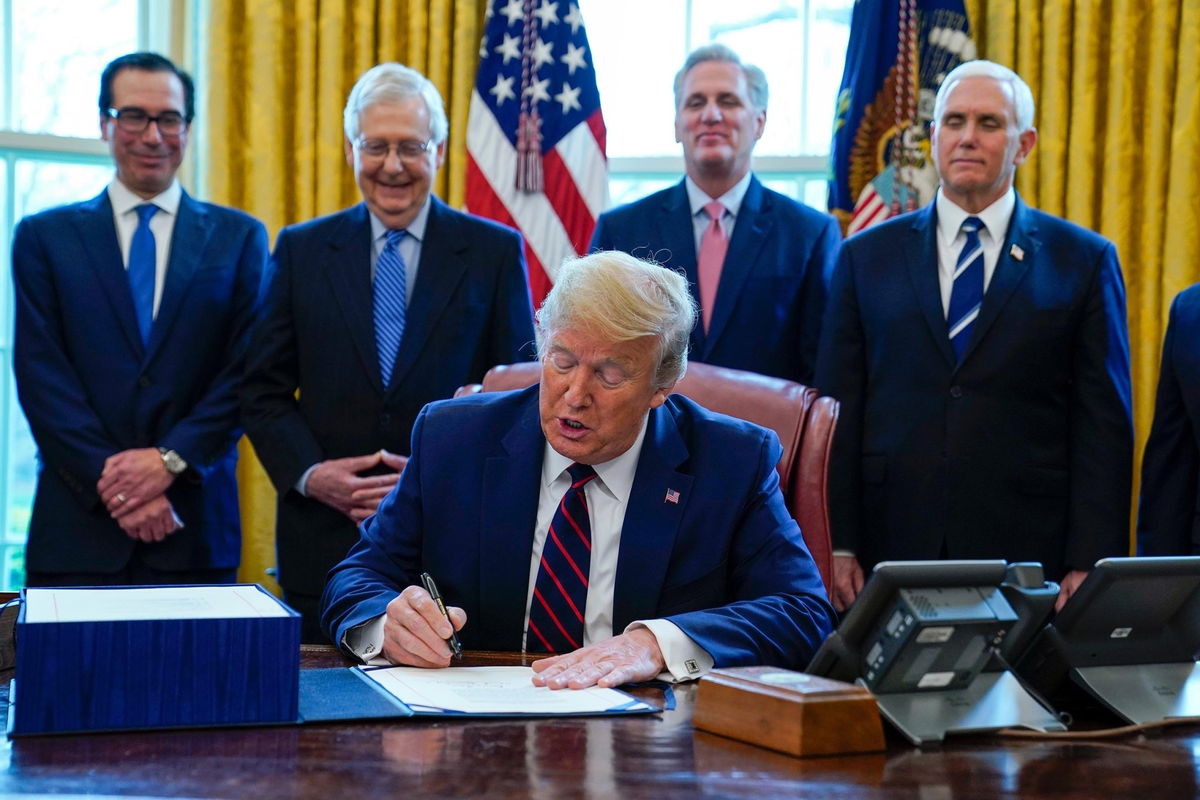 President Donald Trump signs into law a historic $2 trillion stimulus package.