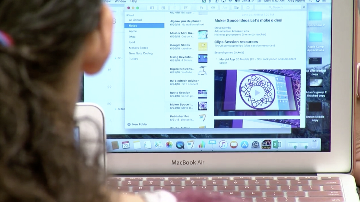 A student looks at her laptop issued by EPISD for online instruction.