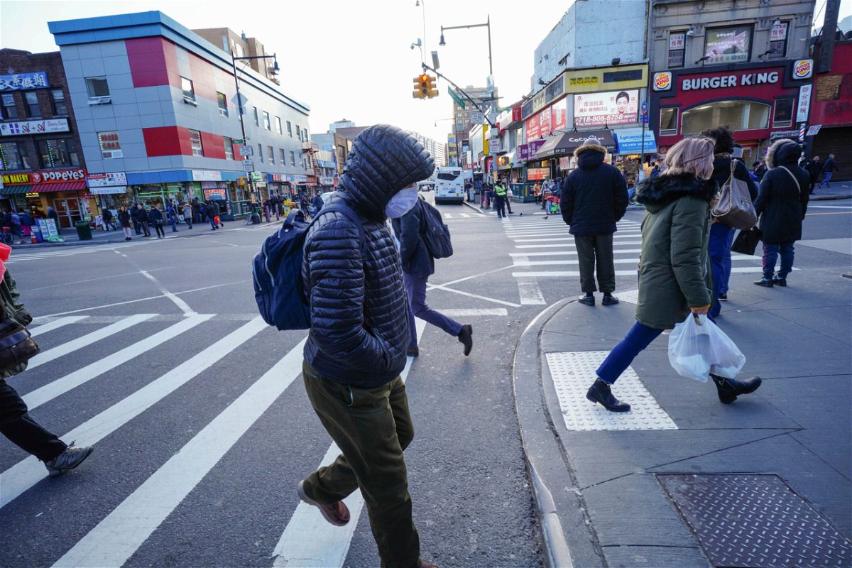 Photo by: John Nacion/STAR MAX/IPx 2020 2/27/20 People wear protective masks to fend off the Corona Virus, while street vendors pedal hand sanitizer and other disinfecting products in Queens, New York.