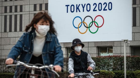 A banner is displayed in Tokyo promoting the 2021 Olympics.