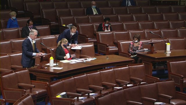 Members of the U.S. House wear masks as they debate a coronavirus relief measure.