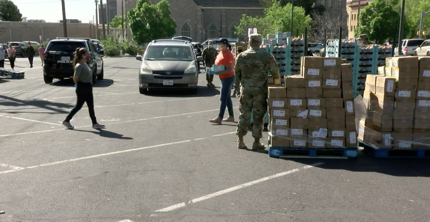 Volunteers distribute food boxes