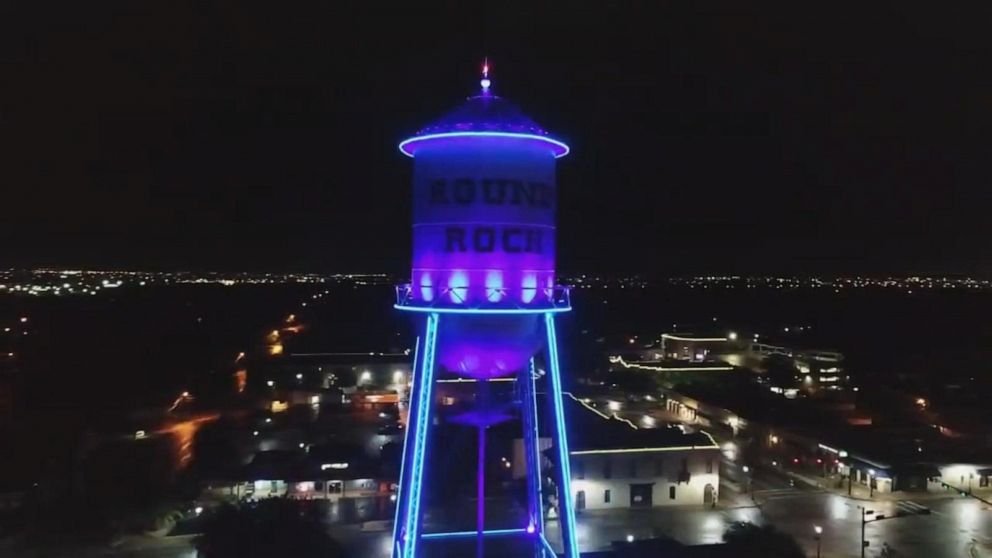 The water tower in the Texas city of Round rock is lit in blue as a tribute to essential workers.
