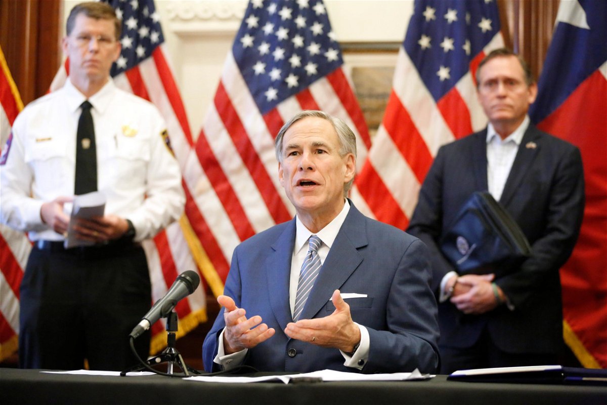 Texas Governor Greg Abbott along with Texas Division of Emergency Management Chief Nim Kidd (left) and health advisor Dr. John Zerwas (right). 