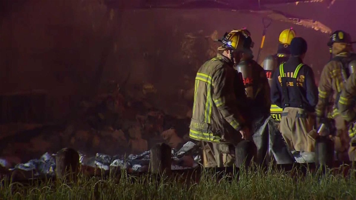 Firefighters a the scene of fire in Dallas involving a truck carrying thousands of rolls of toilet paper.