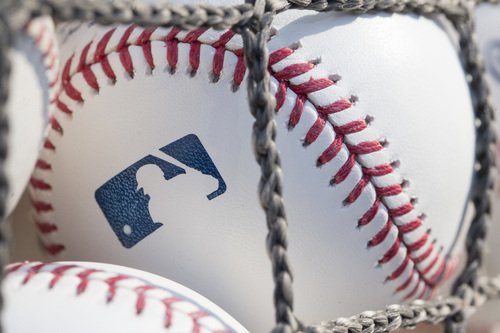 Major league baseballs sit ready for use.