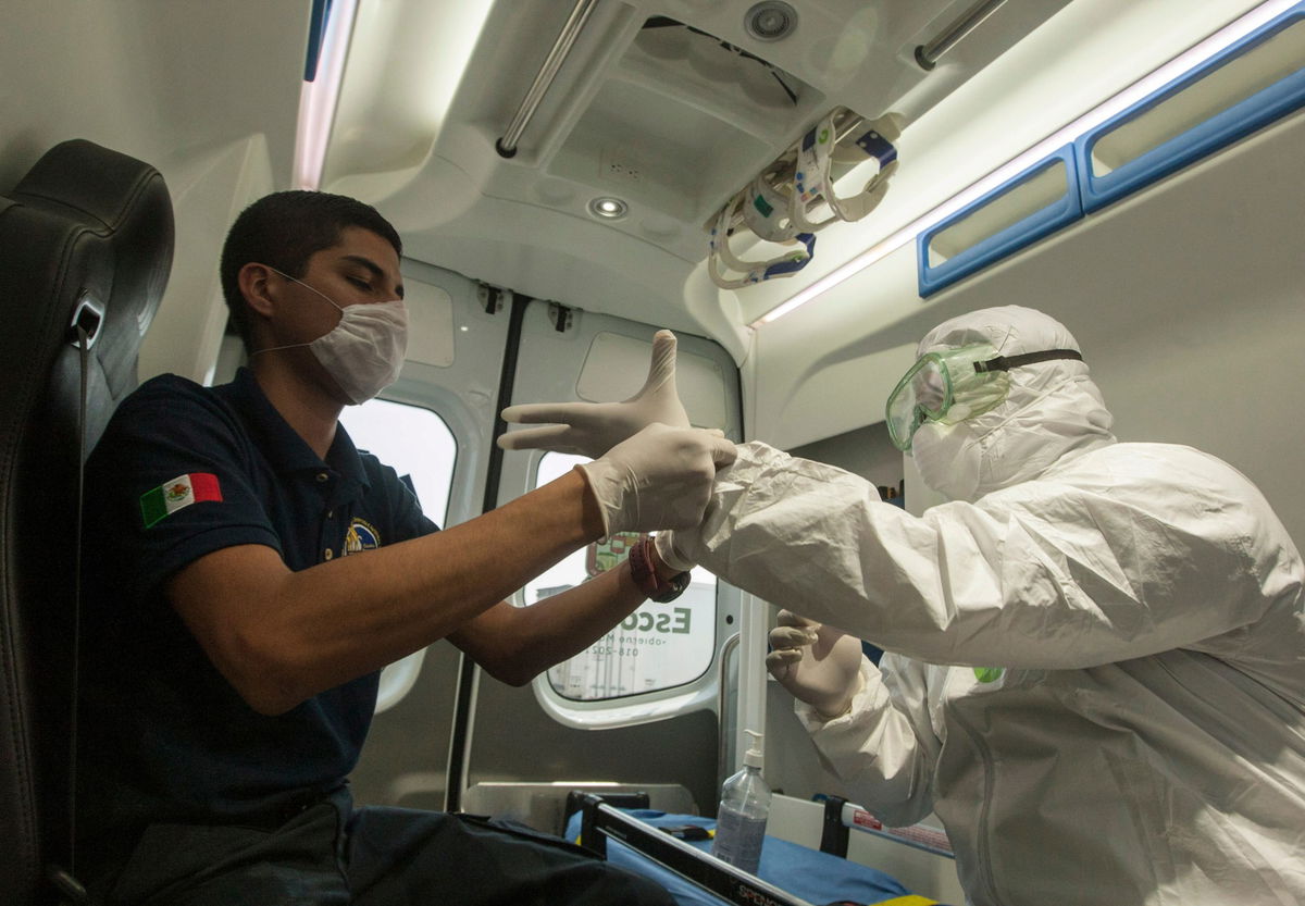 A paramedic from Escobedo, prepares to disinfect a house during a coronavirus drill, in Escobedo Nuevo Leon, Mexico.