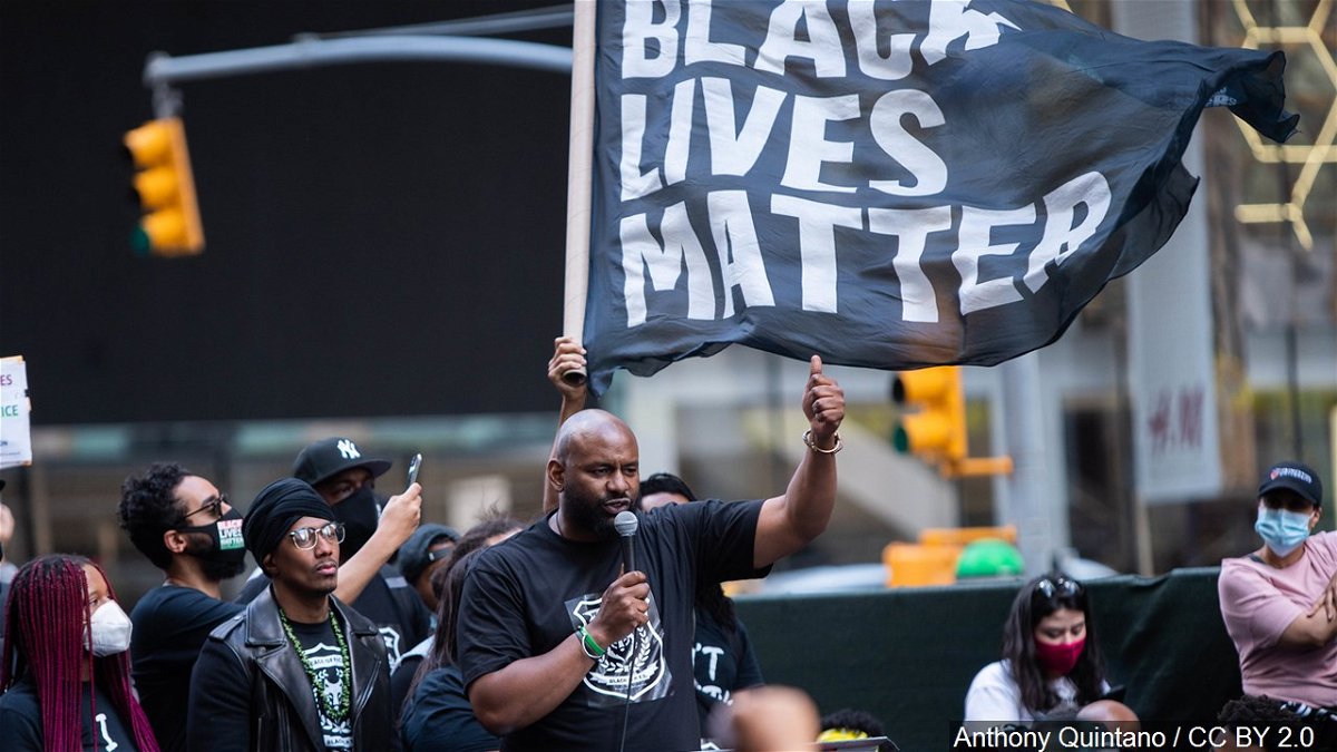 Protesters march with a giant Black Lives Matter banner during a demonstration last year in New York's Times Square.