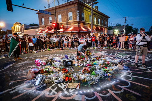 Protesters gather at a memorial for George Floyd where he died outside Cup Foods on East 38th Street and Chicago Avenue in Minneapolis.