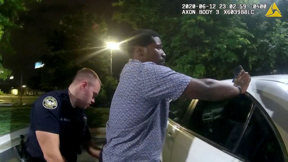 Rayshard Brooks is shown being frisked by an Atlanta police officer in this body cam image.