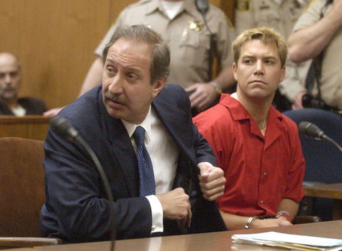 Scott Peterson (right) sits next to his defense lawyer in court.