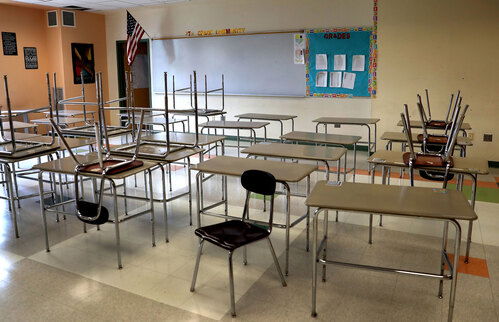 A school classroom sits empty.