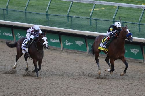 Authentic, right, ridden by jockey John Velazquez, leads down the stretch to defeat Tiz the Law at the Kentucky Derby.