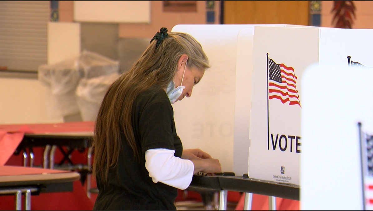 A Doña Ana County woman casts her ballot on Election Day in 2020.