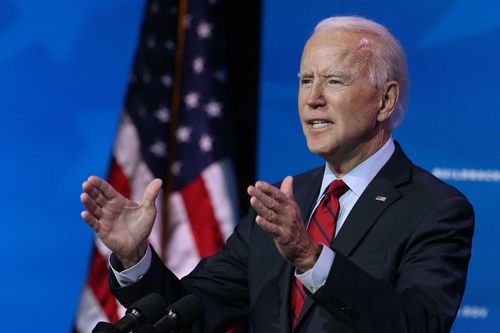 Joe Biden gestures while speaking about his administration.