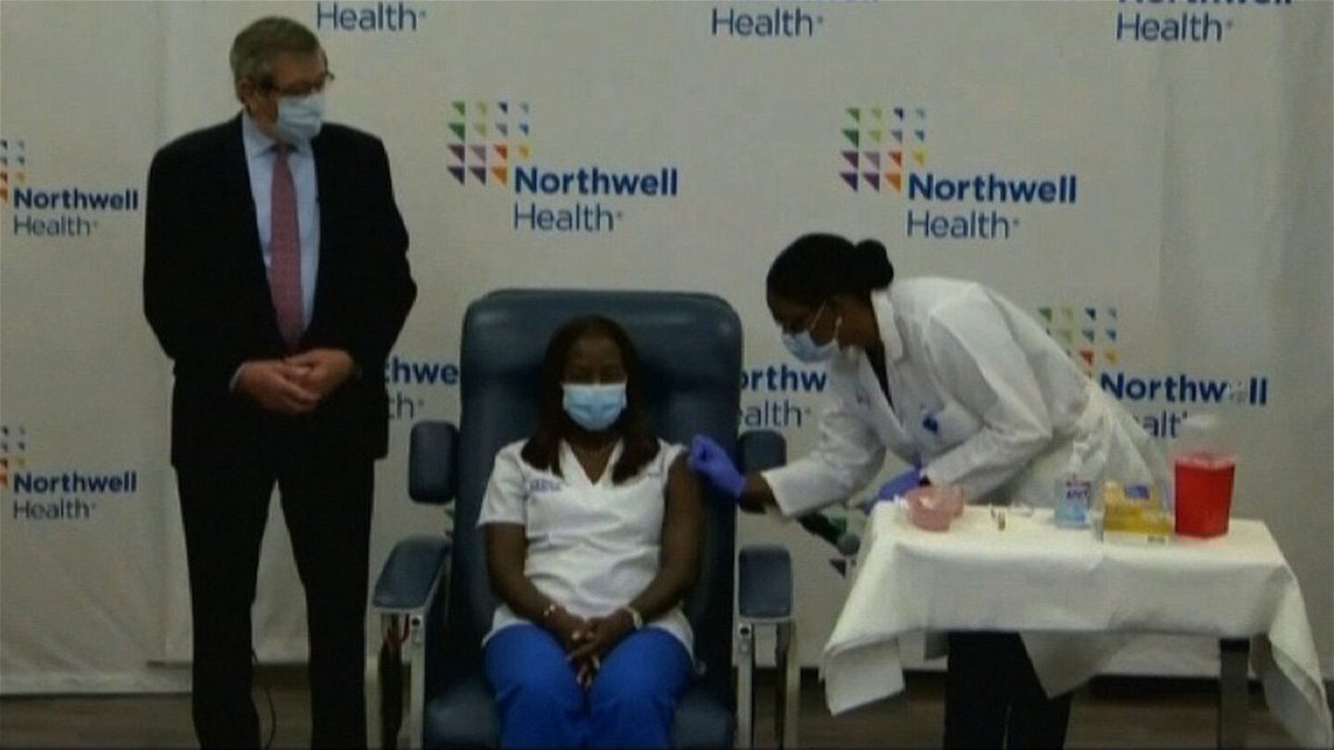 A frontline worker in New York receives the 1st virus vaccine shot in the U.S.