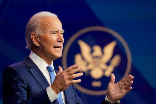 Joe Biden is seen with the U.S. seal behind him.