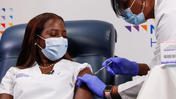 A nurse delivers a Covid-19 vaccination shot.
