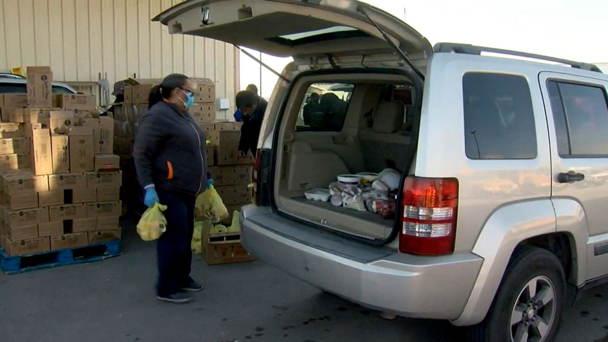 Food is loaded into a vehicle at the SEISD Food Pantry.