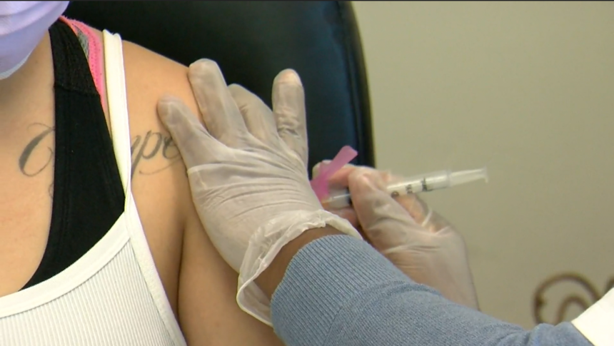 A Las Cruces woman receives her virus vaccination.
