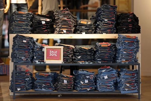 A retail store display showing Levi's blue jeans on sale.