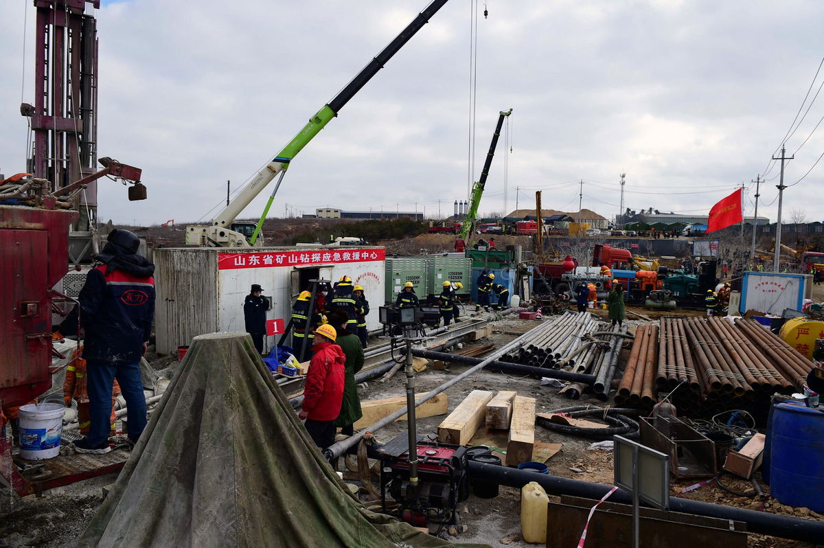 Members of a rescue team working at the site of a gold mine explosion in Qixia, in eastern China's Shandong province. 