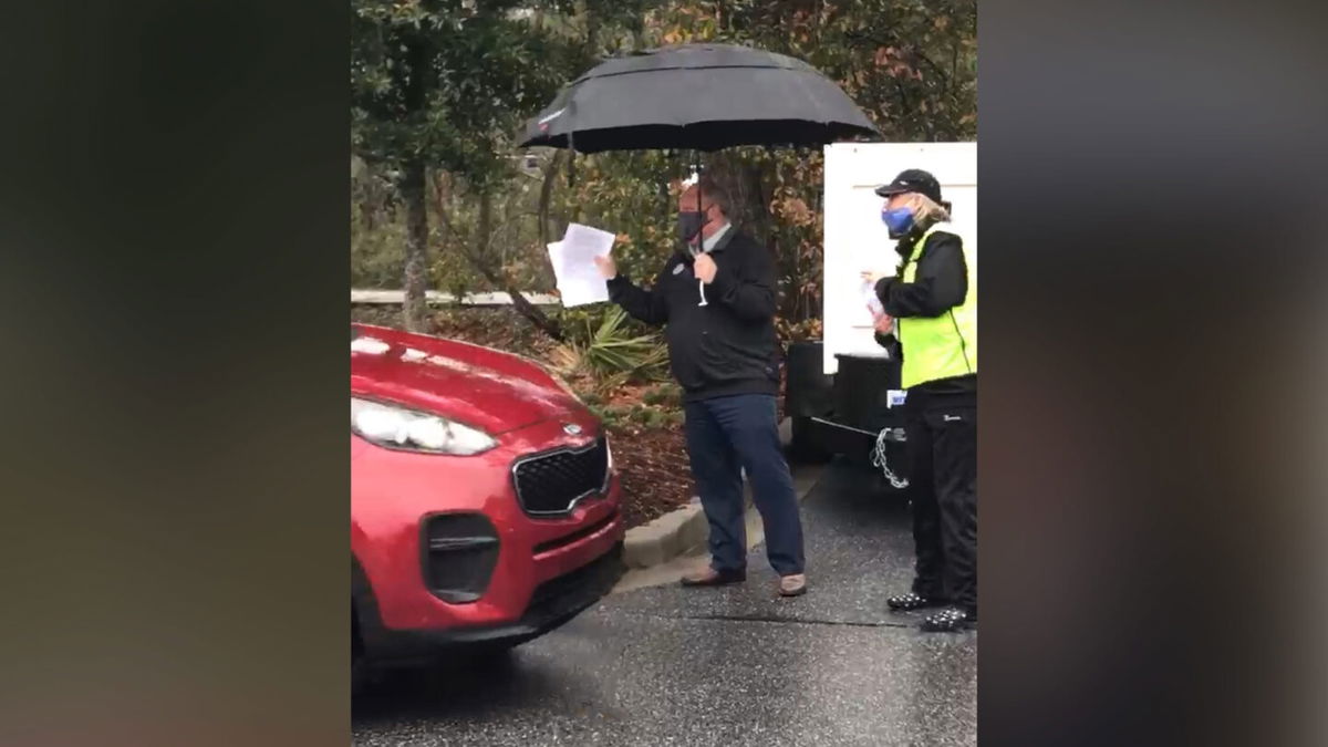 Chick-fil-A manager Jerry Walkowiak is seen here running a drive-thru Covid-19 vaccination clinic in Mount Pleasant, South Carolina.
Photo taken by Sandy Morckel, who gave CNN permission to use across all platforms and distribute to affiliates. Made one time use so it doesn't get grabbed for an unrelated story.