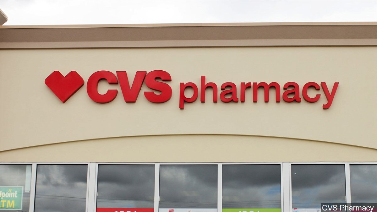 A CVS pharmacy store sign is seen.