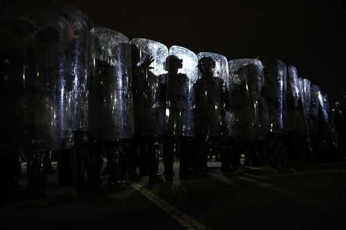 In this image, riot police prepare to move demonstrators away from the U.S. Capitol in Washington D.C. on January 6, 2021.