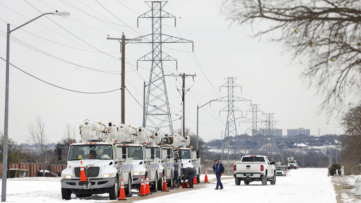 Electric service trucks line up after a winter storm in Fort Worth, Texas. 