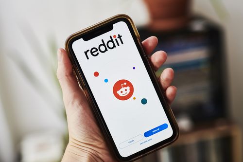 The Reddit app is shown on a cell phone.