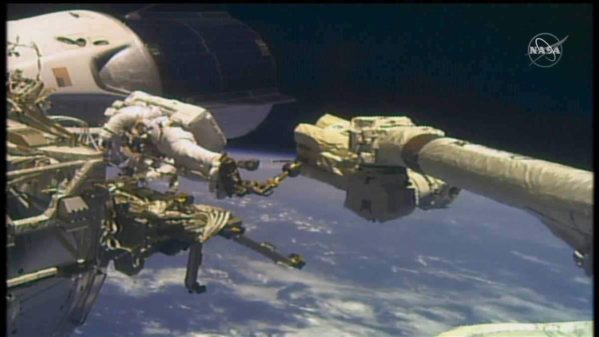 Astronauts Mike Hopkins and Victor Glover Jr. conduct a spacewalk together.