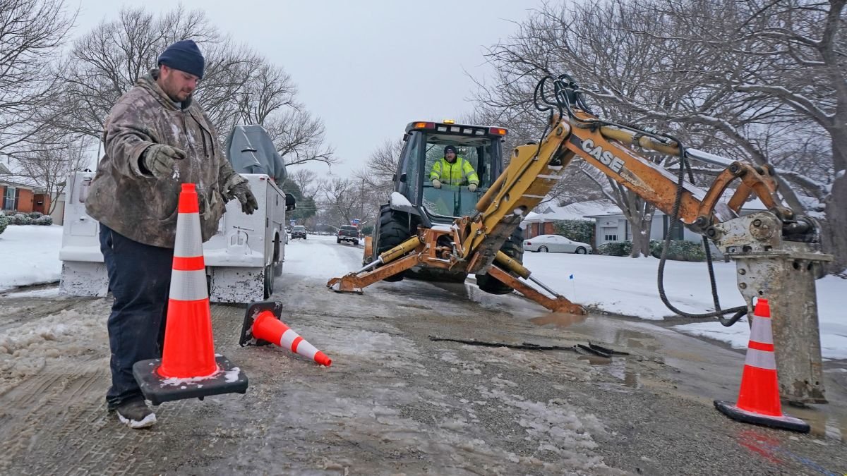 City of Richardson workers prepare to work on a water main pipe that burst due to extreme cold in Texas.