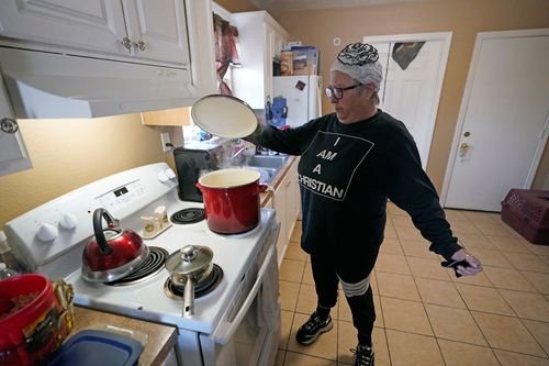 A Texas woman boils water for use in her home.
