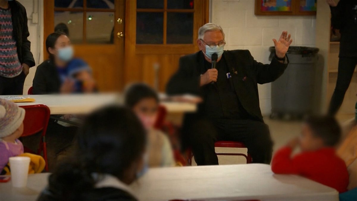 Father Roy Snipes addresses migrants at the Our Lady of Guadalupe church in Mission, Texas.