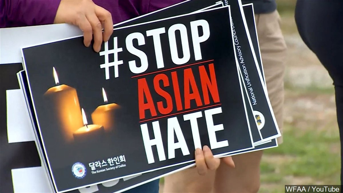A 'Stop Asian Hate' sign is held at a rally in Dallas, Texas.