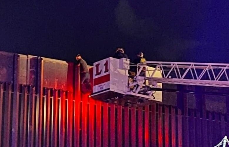 El Paso firefighters rescue man from on top of border wall.