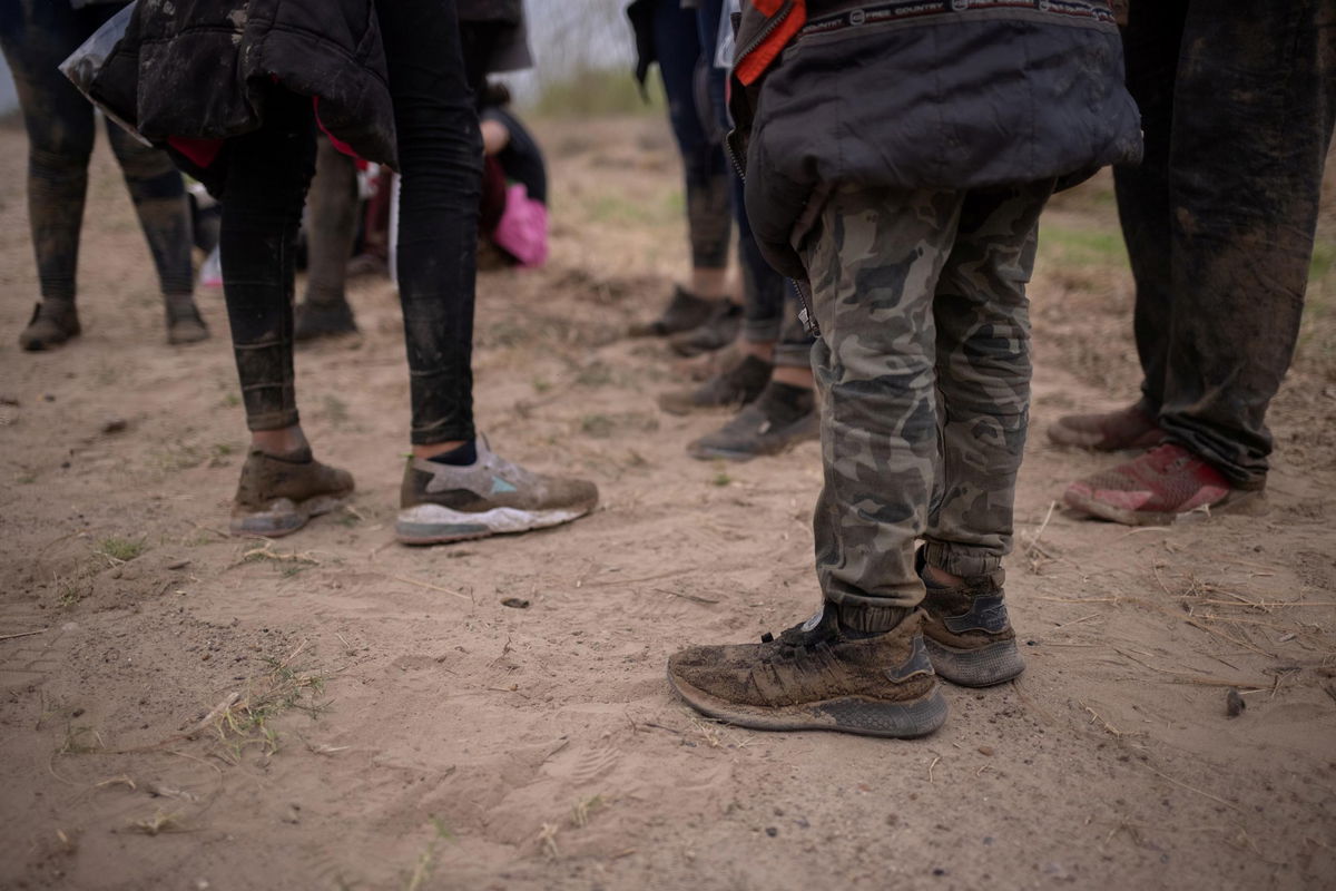 About a dozen asylum seeking unaccompanied minors from Central America are separated from other migrants by U.S. Border Patrol agents after crossing the Rio Grande river into the United States from Mexico on a raft in Penitas, Texas.